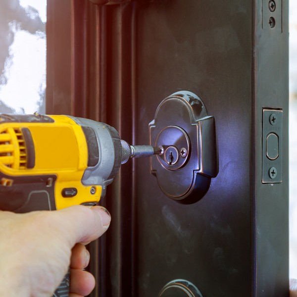 Residential locksmith securing a home with anti-theft locks in Charleston, SC.